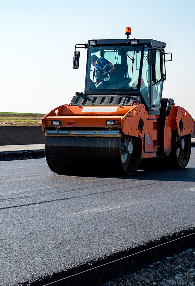 Road rollers building the new asphalt road Diesel powered road roller serviced by Shaw Diesels